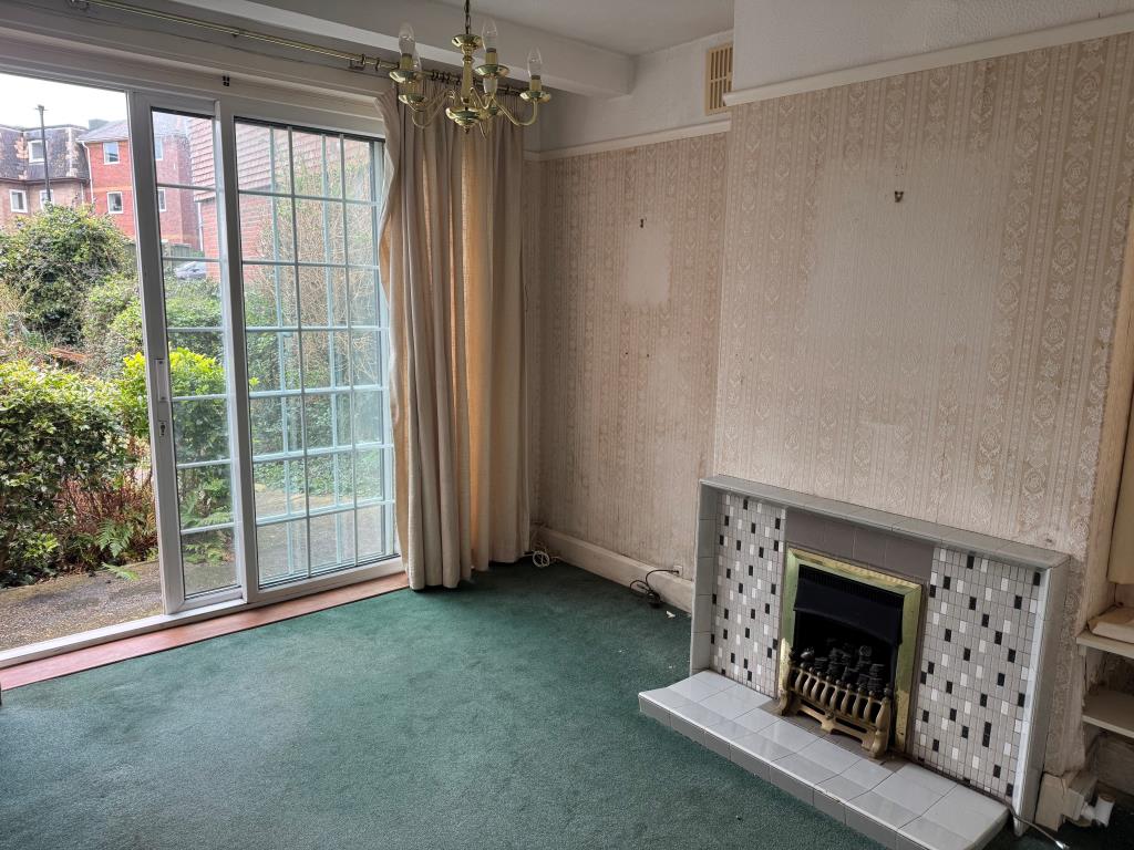 Lot: 53 - FREEHOLD DETACHED CHALET STYLE HOUSE FOR IMPROVEMENT - The Living Room Looking Out Towards the Front